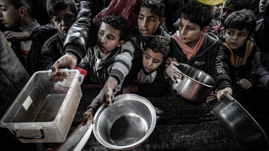 Children waiting for food distribution during humanitarian crisis